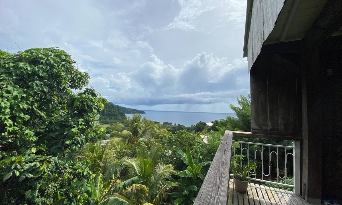 Grand Bay House | Wooden house with an ocean view