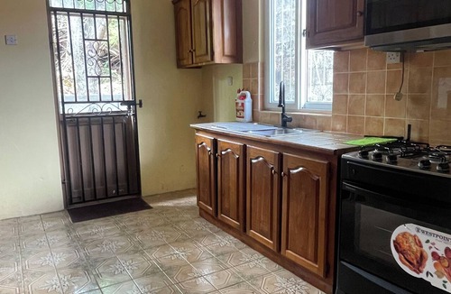 Roseau House | The Yellow Porch, a furnished 2/3 bedroom house with AC in Goodwill, Roseau