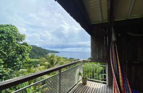 Grand Bay House | Wooden house with an ocean view