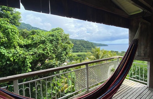 Grand Bay House | Wooden house with an ocean view