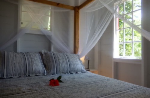 Toucari Cottage | Treetops. A beautiful timber cottage, sea view, private and close to the beach.